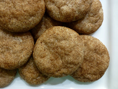 Plate full of sugar cookies that have been rolled in cinnamon before baking