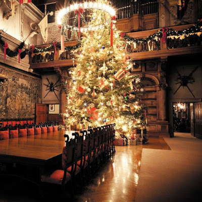 Very tall Christmas tree in a mansion's seven-story dining room