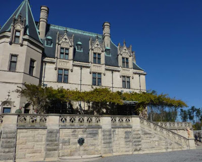 French chateau style mansion and its stone walled terrace