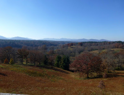 Landscape of mountains, trees and rolling hills in late fall or early winter