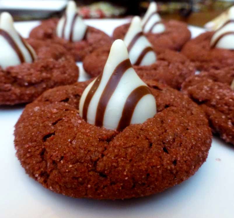 Close-up of red velvet sugar cookies with striped chocolate candy in the center