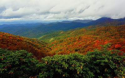 Mountain vistas with varying shades of blue, green, orange, red and yellow